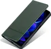 A green leather flip case for a smartphone is shown from a diagonal angle, with the phone screen visible inside. Produktbild-Vorschau