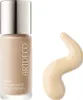A bottle of foundation and a swatch of the product on a white background. Náhled obrázku produktu