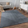 A living room scene with a sofa, rug, and cabinet. Anteprima dell’immagine prodotto