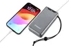 A grey Intenso power bank is shown charging a smartphone. Produktbild-Vorschau