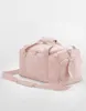 A pink duffel bag is shown against a white background. Anteprima dell’immagine prodotto