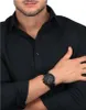 A man wearing a black shirt and a black watch. Náhľad obrázku produktu