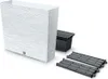 A white planter with a textured surface and a black insert, along with two grey grates, are displayed against a white background. Podgląd zdjęcia produktu