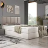 A bedroom scene with a bed, rug, and artwork. Produktbild-Vorschau