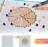 A close-up view of a pegboard with colorful beads being placed to create a pattern, with markers and accessories scattered around. A smaller inset shows a before-and-after of a grid being filled with beads to form a basketball pattern. Produktbild-Vorschau
