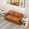 A modern living room scene with a brown sofa and two white S-shaped side tables. Podgląd zdjęcia produktu
