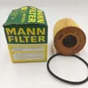 A product box and an oil filter with a rubber seal on a white background. Voir les images du produit