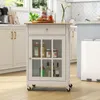 A white kitchen cart with a wooden top is shown in a kitchen setting. Podgląd zdjęcia produktu