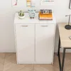 A white two-door cabinet with decorative items on top, placed against a white wall with wooden flooring. Podgląd zdjęcia produktu