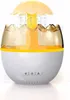 A white and yellow egg-shaped humidifier with water droplets falling from the top. Produktbild-Vorschau