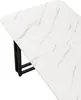 A close-up, angled view of a white marble-patterned tabletop with a black metal leg structure visible underneath. Produktbild-Vorschau