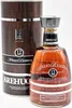 A bottle of Arehucas Ron Reserva Special 12 Anos rum and its cylindrical presentation box. Produktbild-Vorschau