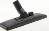 A close-up studio shot of a black vacuum cleaner floor head against a white background. Produktbild-Vorschau