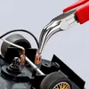 A close-up shot of Knipex electronics pliers gripping a wire terminal on a black plastic object, possibly a toy car chassis. Anteprima dell’immagine prodotto