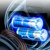 An artistic rendering of two cylindrical batteries or power cells, surrounded by glowing blue energy and abstract light trails. A dark, circular object is in the foreground. Náhled obrázku produktu