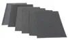 A set of gray sheets, possibly gasket material, are fanned out on a white background. Voir les images du produit