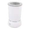 A white automatic dog paw cleaner with a gray rim and a silver accent band around the base. Voir les images du produit