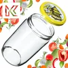 A glass jar with a lid, surrounded by various vegetables and herbs. Produktbild-Vorschau