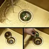 A collage of images showing a kitchen sink drain with a strainer and a hand removing debris from it. Podgląd zdjęcia produktu