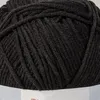 A close-up view of a ball of black yarn. Produktbild-Vorschau