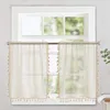 Two sheer curtains with tassels hanging on a window rod in front of a window. Anteprima dell’immagine prodotto