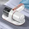 A handheld vacuum cleaner with a transparent dustbin and rose gold accents is placed on a stack of folded bedding. Produktbild-Vorschau