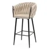A beige bar stool with a braided backrest and black metal legs is shown against a white background. Podgląd zdjęcia produktu