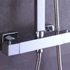 A close-up of a modern chrome shower fixture against a textured gray wall. Náhled obrázku produktu
