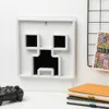A Minecraft Creeper-shaped lamp is displayed on a white desk, with a game controller and books nearby. Anteprima dell’immagine prodotto