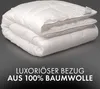 A folded white duvet is shown against a dark gray to black gradient background. Text is overlaid at the bottom of the image. Produktbild-Vorschau