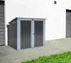 A grey and anthracite storage box is placed on a paved patio next to a white building. Náhled obrázku produktu