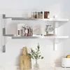 A kitchen counter with a tiled backsplash, featuring a two-tiered wall shelf holding various kitchen items. Produktbild-Vorschau