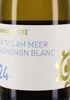 A close-up of a wine bottle label. Produktbild-Vorschau