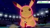 A giant Pikachu is battling a trainer in an arena. Produktbild-Vorschau