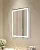 A modern LED bathroom mirror mounted on a textured wall above a sink. Náhled obrázku produktu