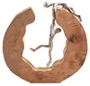 A decorative sculpture of two figures interacting with a wooden frame. Náhled obrázku produktu