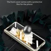 A phone case is shown with a metallic sphere hovering above it, set against a dark, abstract background with sharp geometric shapes. Náhled obrázku produktu