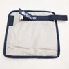 A close-up view of a Bucas Click'n Go Panel Extender Power, showing the silver panel and navy blue trim and strap. Anteprima dell’immagine prodotto