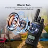 A walkie-talkie is shown with a graphic representation of sound waves emanating from a speaker, set against a blurred background of tents and camping chairs. Produktbild-Vorschau