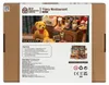 The image shows the packaging of a DIY miniature house kit, specifically a "Tipsy Restaurant" model. The front of the box features a detailed image of the assembled miniature restaurant, complete with a teddy bear, drinks, and food items. There is also a s Voir les images du produit