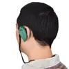 A person wearing a green ear-mounted radio. Voir les images du produit
