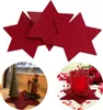 A collage of red felt stars, a Christmas tree and gnome decoration on a windowsill, and a red candle holder with red beads. Produktbild-Vorschau
