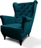 A teal wingback armchair with tufted backrest and wooden legs, shown against a white background. Náhled obrázku produktu