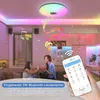 A modern living room with a colorful LED ceiling light and two people interacting. Voir les images du produit