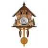 A decorative cuckoo clock designed to look like a wooden house, with figures and a deer. Produktbild-Vorschau