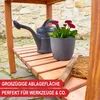 A wooden shelf with gardening tools and a potted plant. Produktbild-Vorschau