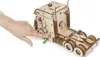 A hand is shown interacting with a wooden model truck. Podgląd zdjęcia produktu