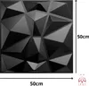A black 3D wall panel with geometric patterns, with dimensions indicated. Produktbild-Vorschau