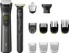 A collection of grooming tools and accessories, including two electric shavers and various attachments, laid out against a white background. Náhled obrázku produktu