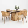 A dining table with four chairs set against a white background. Produktbild-Vorschau